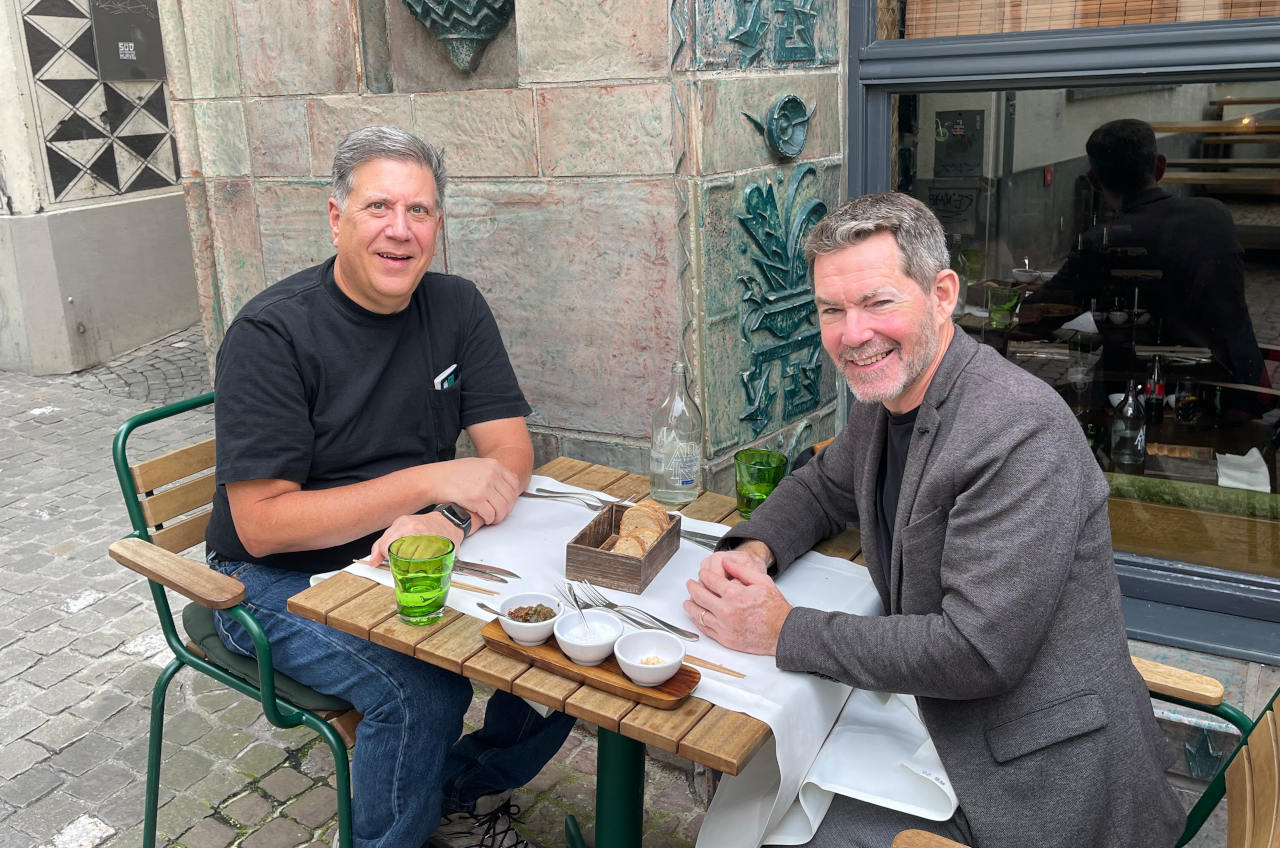 Me and Alex at a table outside of a restaurant